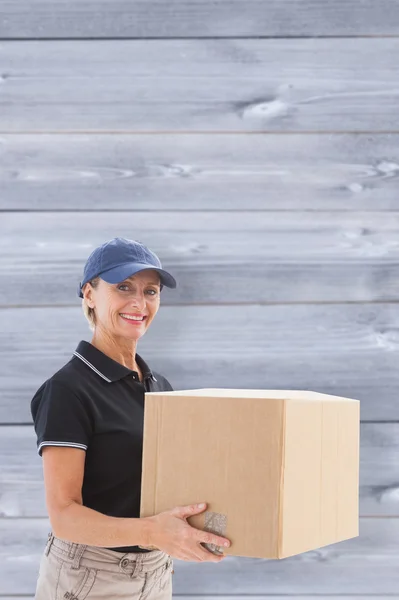 Delivery woman holding cardboard box — Stock Photo, Image