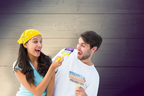 Couple painting together and laughing — Stock Photo, Image