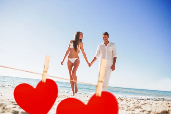 Blonde holding hands with handsome boyfriend — Stock Photo, Image