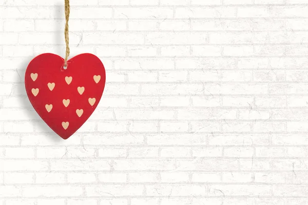 Heart decoration against white wall — Stock Photo, Image