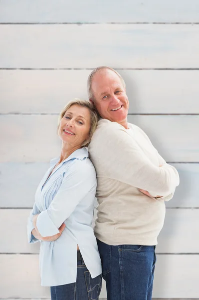 Mature couple standing and smiling — Stock Photo, Image