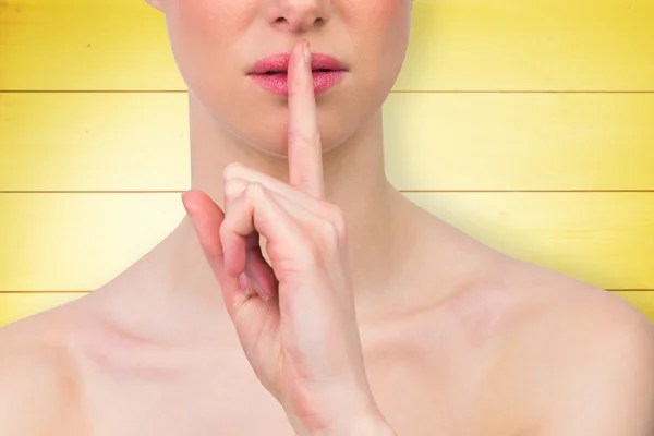 Beautiful woman making quiet gesture — Stock Photo, Image