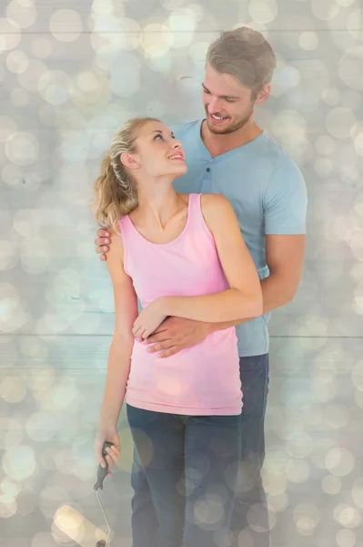 Young couple painting with roller — Stock Photo, Image