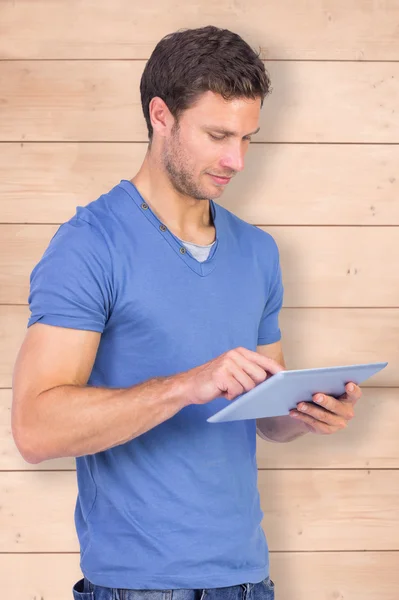 Man scrolling through tablet pc — Stock Photo, Image