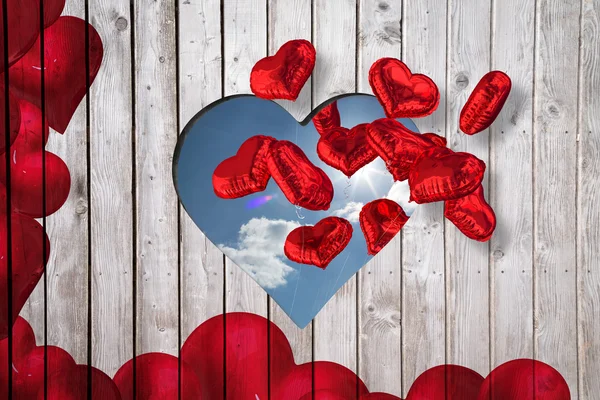 Red love hearts against cloudy sky — Stock Photo, Image