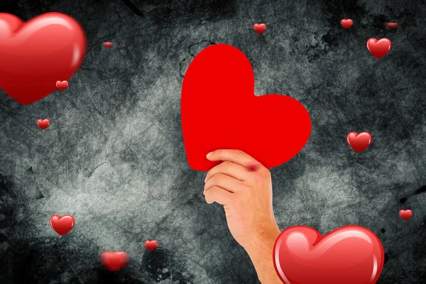 Hand with heart against hearts — Stock Photo, Image