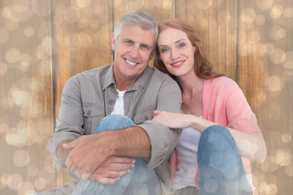 Casual couple sitting and smiling — Stock Photo, Image