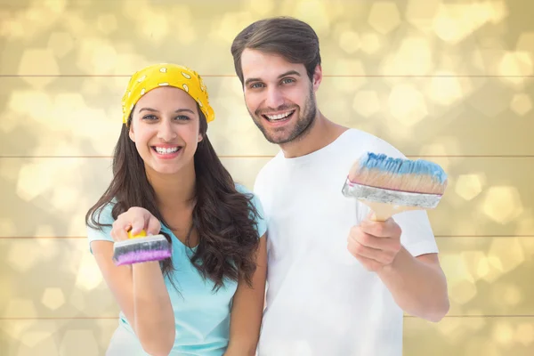 Happy young couple painting together — Stock Photo, Image