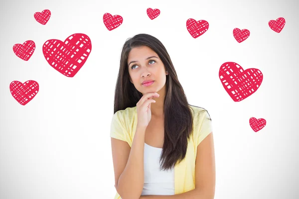 Vrouw denken met hand op kin — Stockfoto