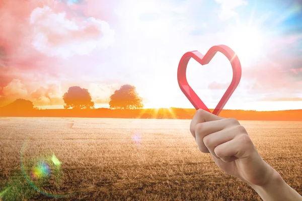 Red love heart against countryside scene — Stock Photo, Image