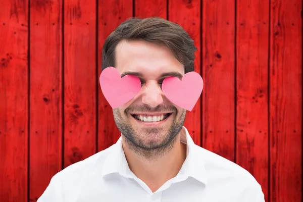 Hombre con corazones sobre sus ojos —  Fotos de Stock