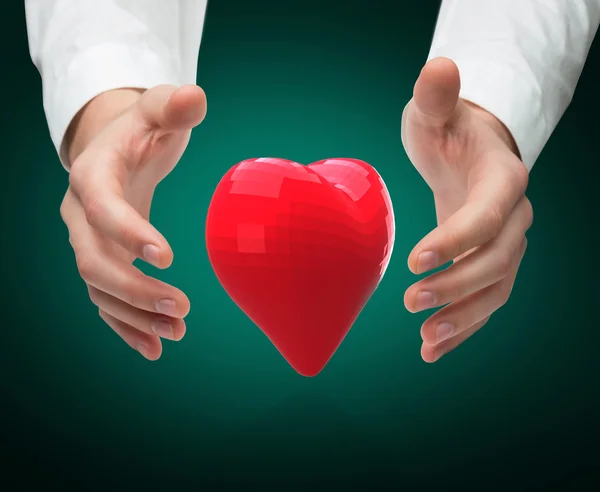 Hands holding heart — Stock Photo, Image