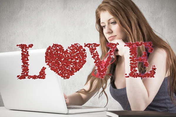 Pretty redhead working on laptop — Stock Photo, Image