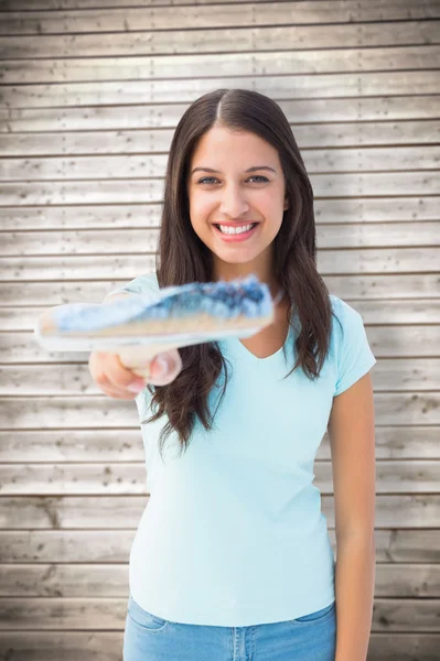 Young brunette holding paintbrush — Stock Photo, Image