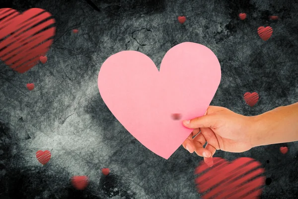 Hand with heart against hearts — Stock Photo, Image