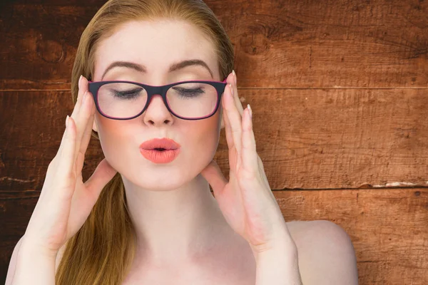 Beautiful redhead posing with glasses — Stock Photo, Image