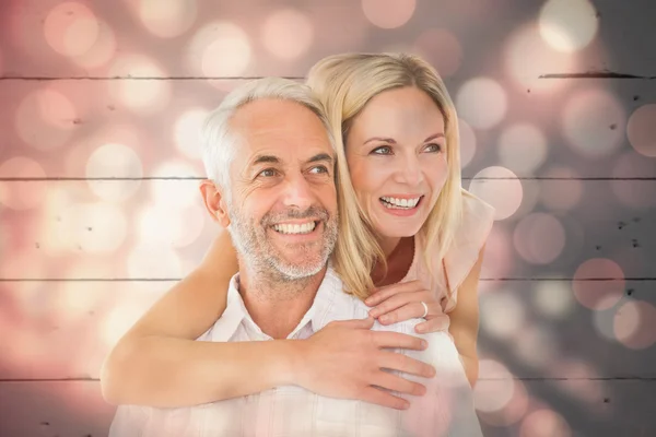 Man giving his partner a piggy back — Stock Photo, Image