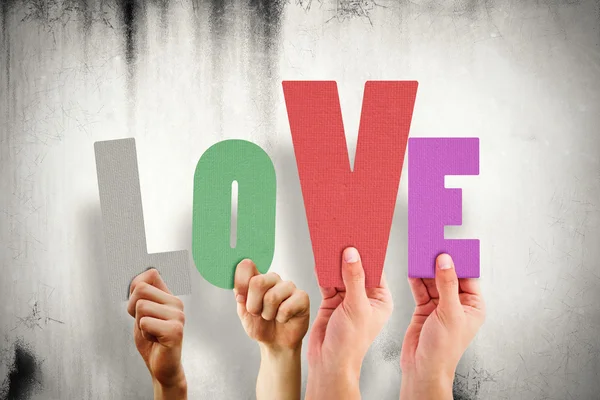 People holding word love — Stock Photo, Image