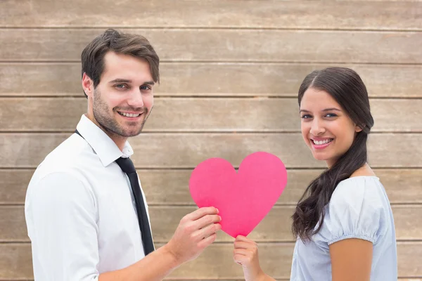 Brunette giving boyfriend her heart — Stock Photo, Image