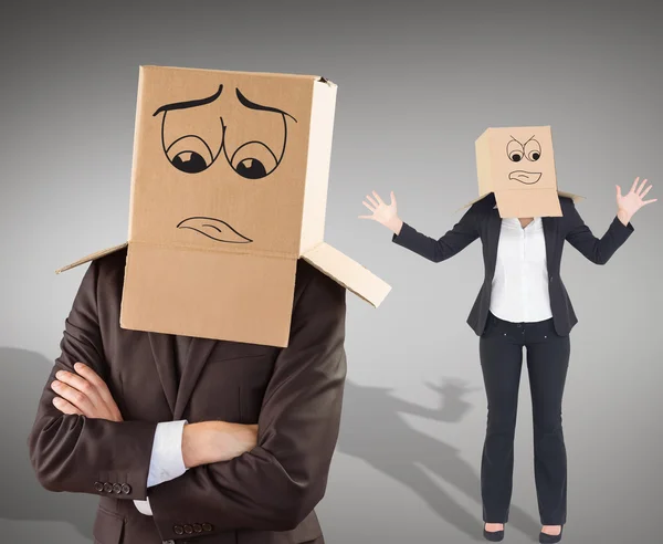 Businesspeople with boxes over head — Stock Photo, Image