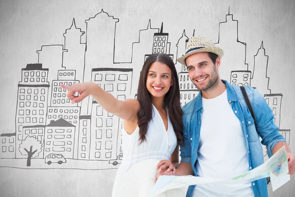 Happy hipster couple looking at map — Stock Photo, Image