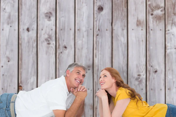 Casual couple lying on floor — Stock Photo, Image