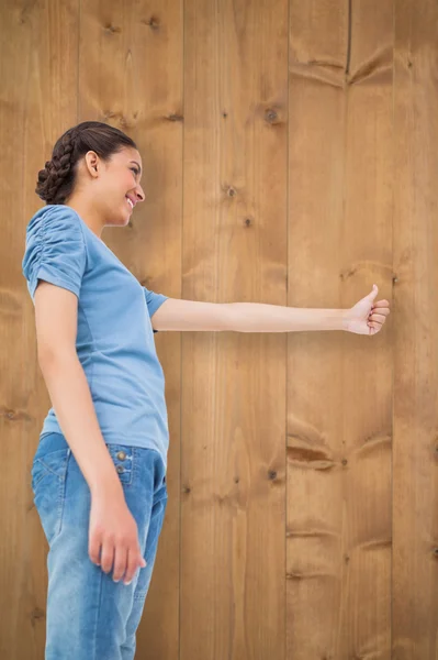 Pretty brunette giving thumbs up — Stock Photo, Image