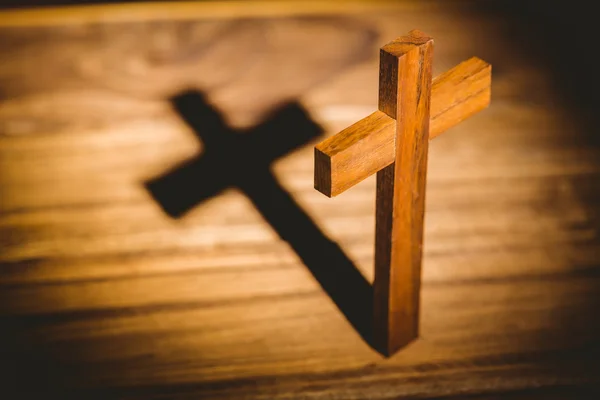 Crucifix icon on table in the shadow — Stock Photo, Image