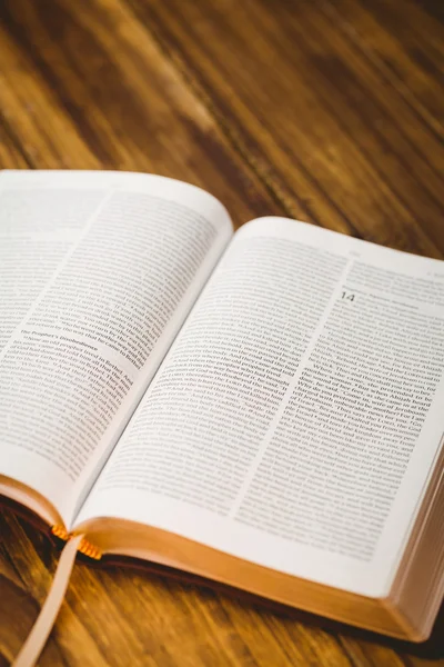 Open bible on wooden table — Stock Photo, Image