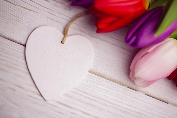 Bunch of tulips and heart card — Stock Photo, Image