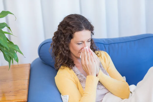Sick woman blowing her nose — Stock Photo, Image