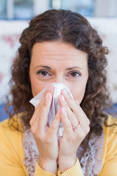 Sick woman blowing her nose — Stock Photo, Image