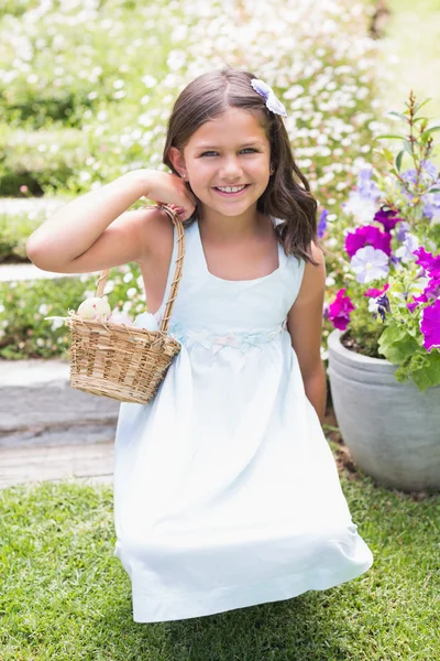 Happy girl collecting easter eggs — Stock Photo, Image