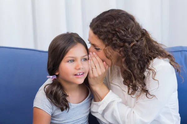 Mother and daughter whispering — Stock Photo, Image