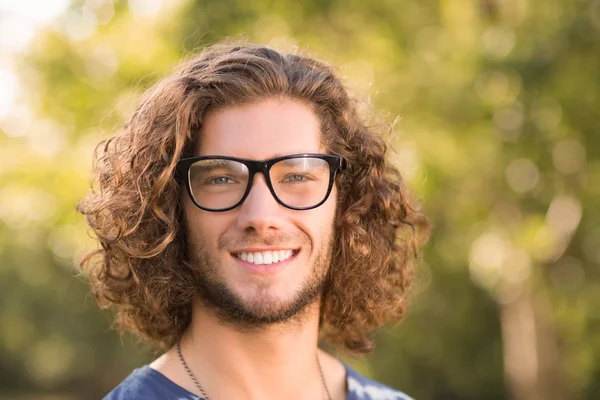 Handsome hipster in the park — Stock Photo, Image