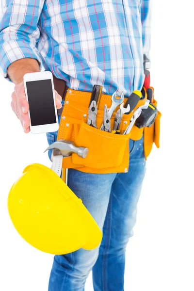 Handyman visar smartphone — Stockfoto