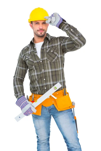 Repairman holding spirit level — Stock Photo, Image