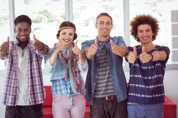 Fashion students smiling at camera together — Stock Photo, Image