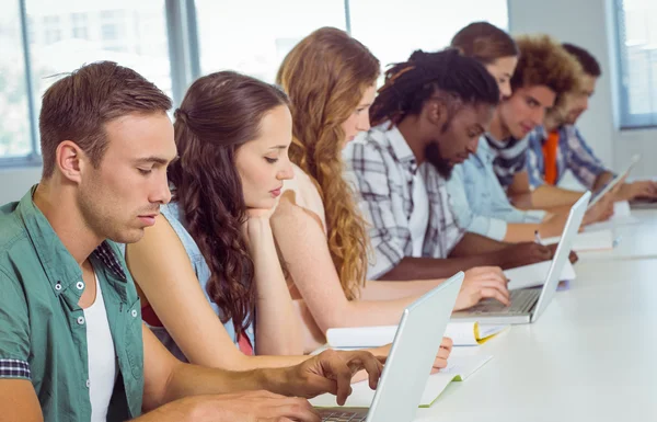 Fashion students using laptop — Stock Photo, Image