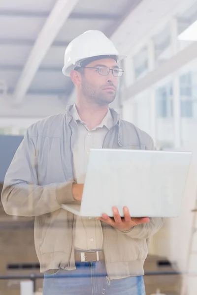Architect using laptop in office — Stock Photo, Image