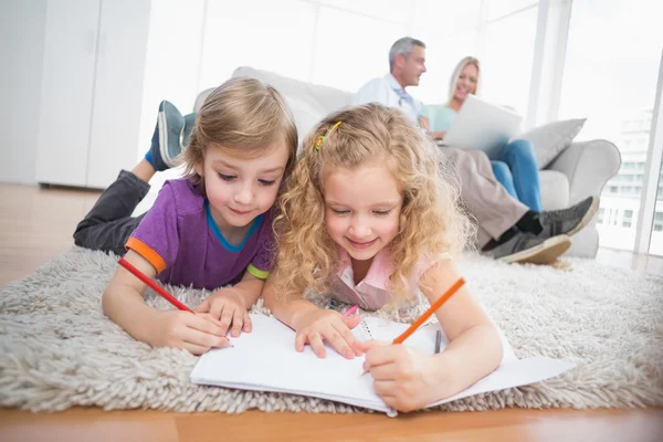 Children drawing on papers at home — Stock Photo, Image