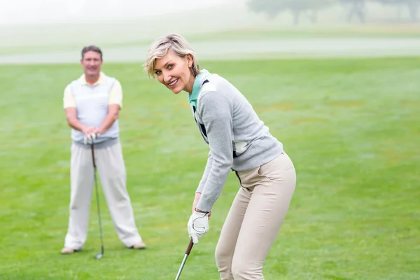 Lady golfer watched by partner — Stock Photo, Image