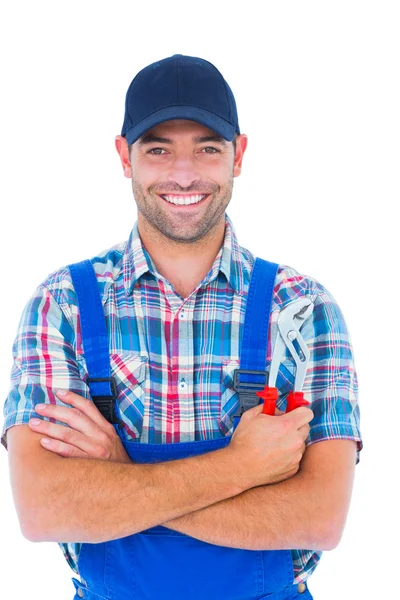 Happy repairman holding pliers — Stock Photo, Image