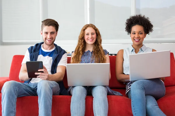 Creative team using laptops and digital tablet — Stock Photo, Image