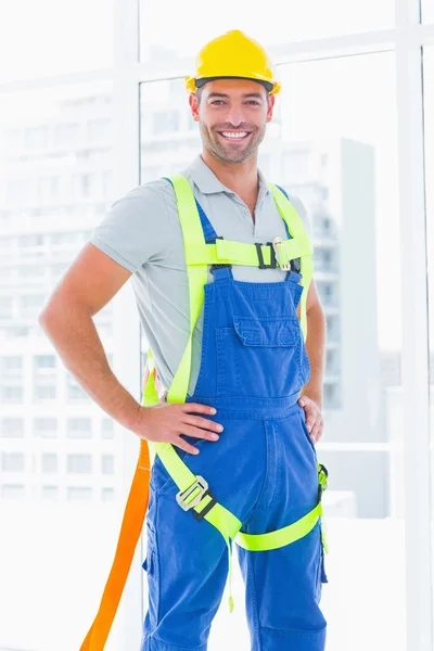 Construction worker wearing safety harness — Stock Photo, Image