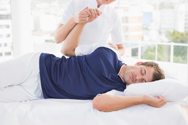 Doctor examining man arm — Stock Photo, Image