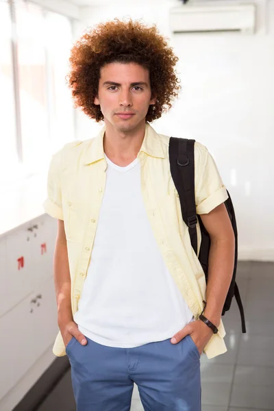Casual young man in office corridor — Stock Photo, Image