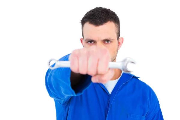 Confident male mechanic holding spanner — Stock Photo, Image