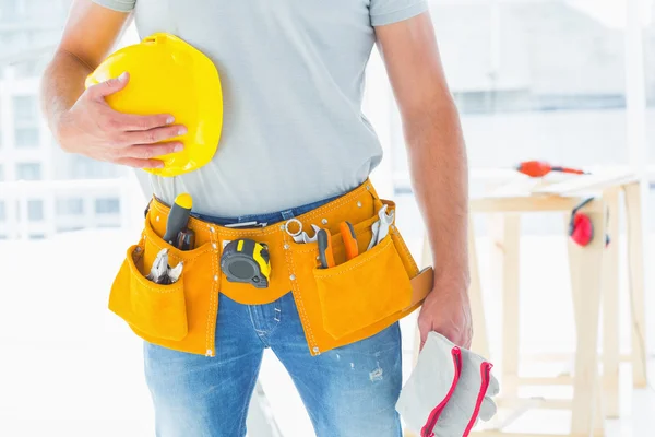 Handyman with gloves and helmet — Stock Photo, Image