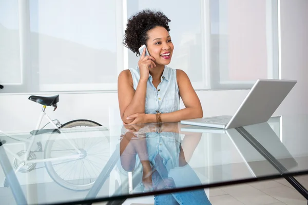 Young casual woman using cellphone — Stock Photo, Image